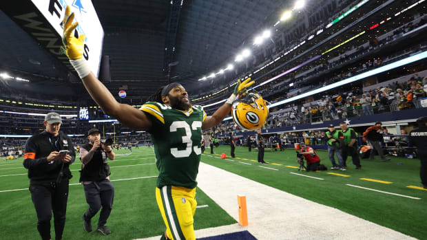 Jan 14, 2024; Arlington, Texas, USA; Green Bay Packers running back Aaron Jones (33) reacts after defeating the Dallas Cowboys in the 2024 NFC wild card game at AT&T Stadium.